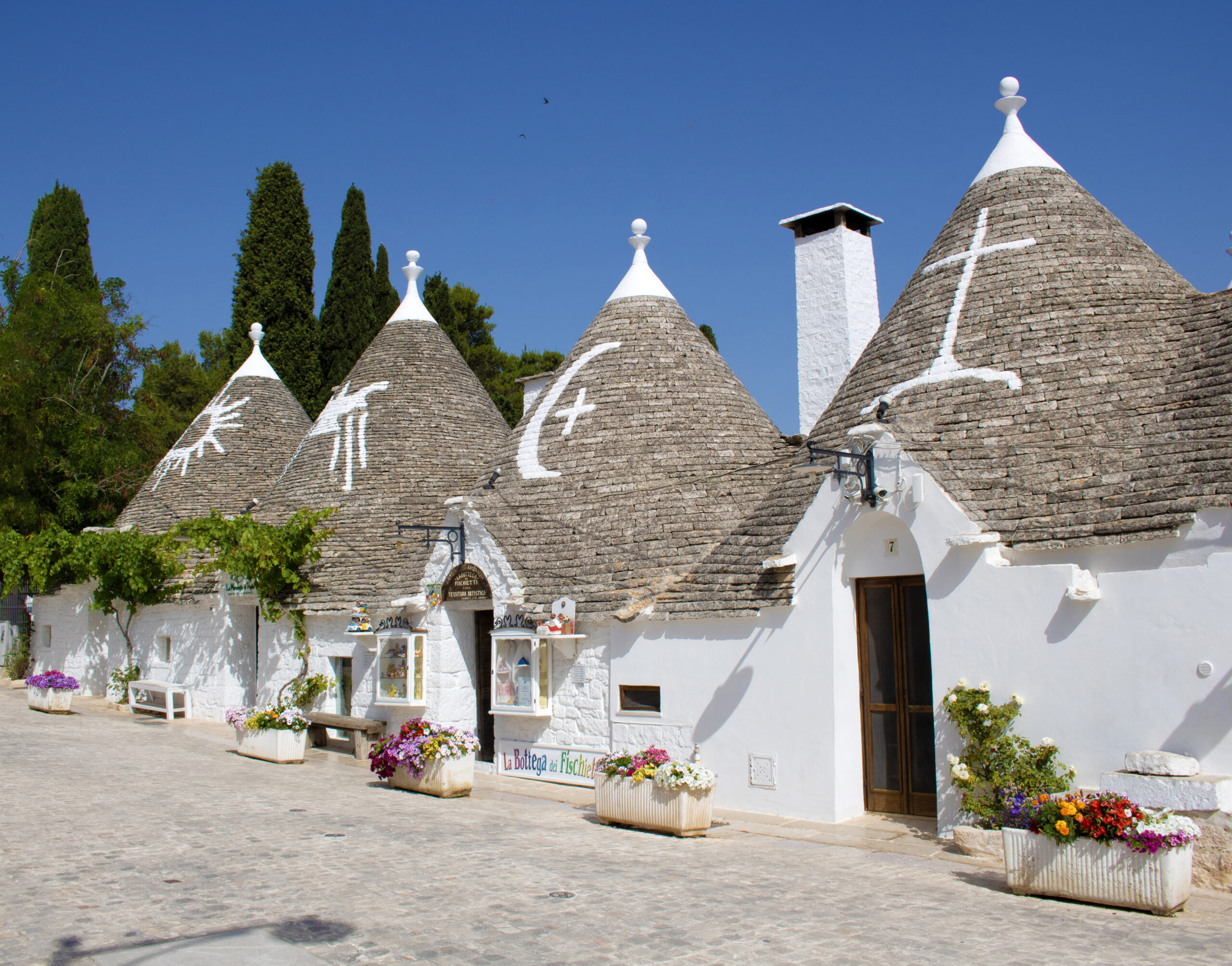 Traditional trulli houses with conical roofs in Alberobello, Puglia